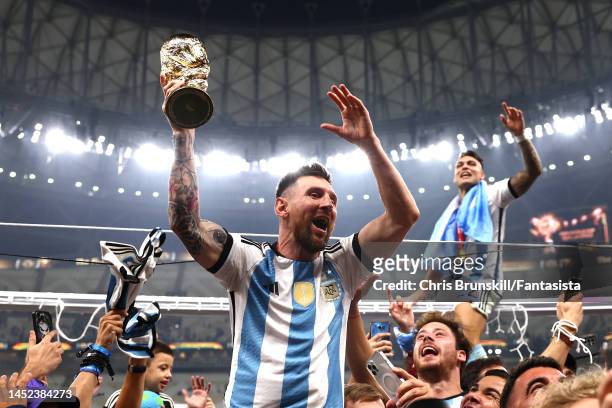 Lionel Messi of Argentina celebrates with the FIFA World Cup trophy following the FIFA World Cup Qatar 2022 Final match between Argentina and France...