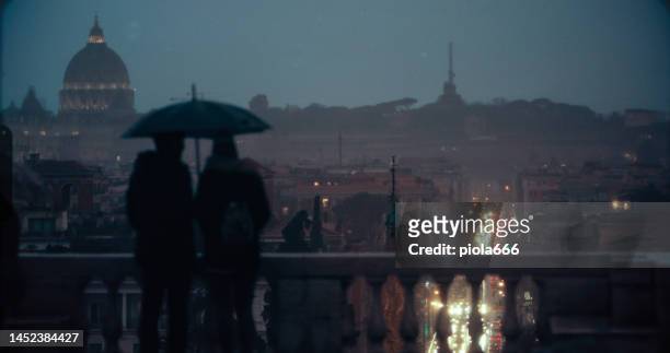 melancholy in rome with tourists and rain - piazza del popolo rome stock pictures, royalty-free photos & images