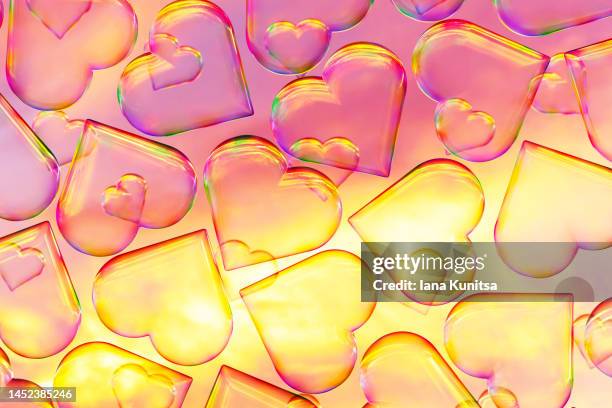 colorful soap bubbles in shape of heart on sky background. beautiful 3d pattern. yellow and purple clouds backdrop. valentine's day. - heart shape 3d stock pictures, royalty-free photos & images