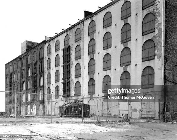 Civil War era warehouse on the waterfront in Red Hook Brooklyn with arched windows and metal shutters in 1992 in Brooklyn in New York.