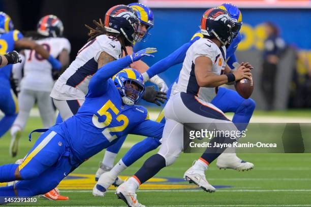 Kevin Couser of the Los Angeles Rams sacks Russell Wilson of the Denver Broncos during the first quarter of the game at SoFi Stadium on December 25,...