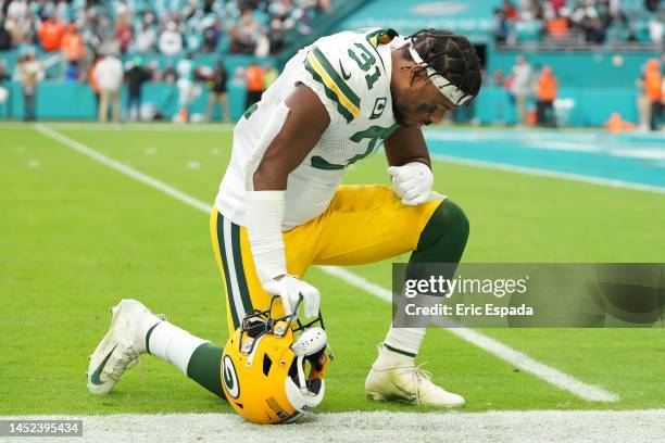 Adrian Amos of the Green Bay Packers prays before exiting the field after the game against the Miami Dolphins at Hard Rock Stadium on December 25,...