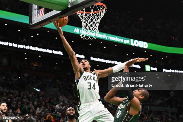 Giannis Antetokounmpo of the Milwaukee Bucks attempts a layup against Al Horford of the Boston Celtics during the fourth quarter at the TD Garden on...