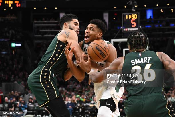 Giannis Antetokounmpo of the Milwaukee Bucks reacts after being fouled by Jayson Tatum of the Boston Celtics during the third quarter at the TD...