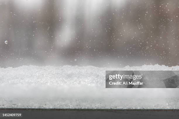 snow accumulated by window - schneehaufen stock-fotos und bilder