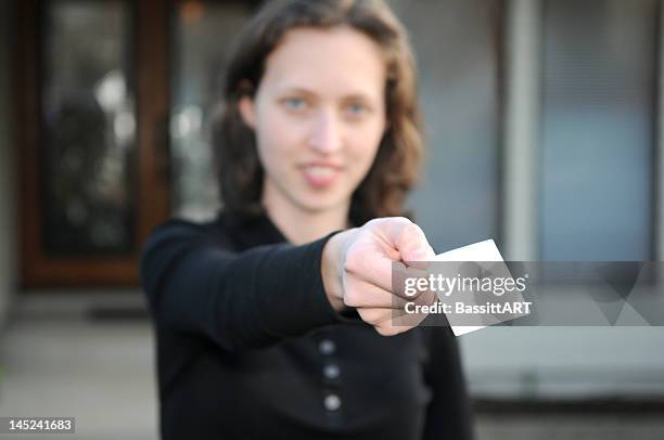 aquí mi tarjeta - business person handing over a letter fotografías e imágenes de stock