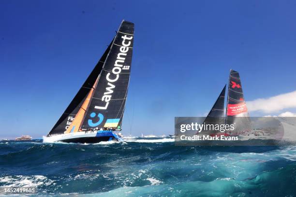 Law Connect and Wild Oats lead the fleet out of the heads during the 2022 Sydney to Hobart on Sydney Harbour, on December 26, 2022 in Sydney,...