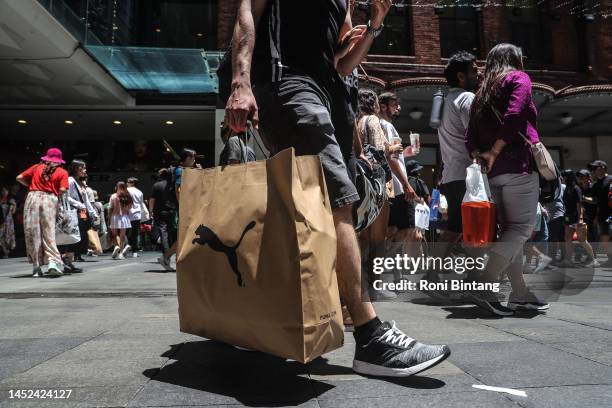 Shoppers are seen in the Pitt Street Mall during the Boxing Day sales on December 26, 2022 in Sydney, Australia. Retailers offer massive discounts...