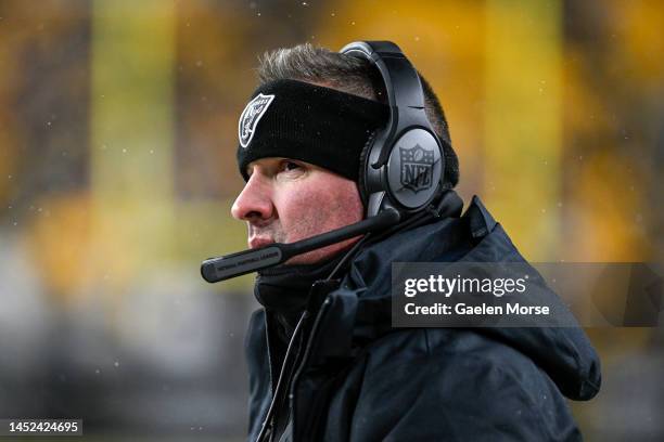 Las Vegas Raiders head coach Josh McDaniels looks on during the fourth quarter against the Pittsburgh Steelers at Acrisure Stadium on December 24,...