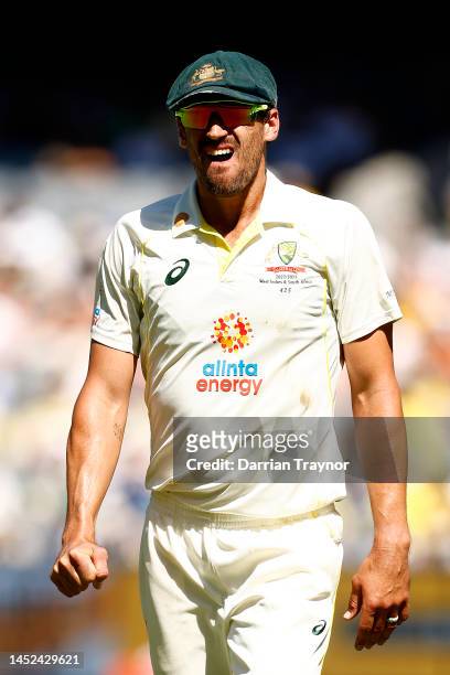 Mitchell Starc of Australia leaves the field due to a hand injury during day one of the Second Test match in the series between Australia and South...