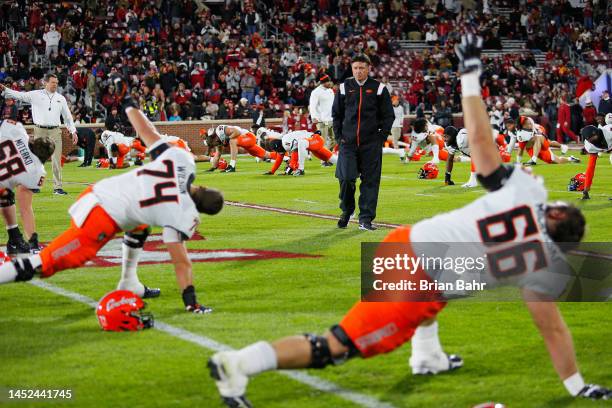 Head coach Mike Gundy of the Oklahoma State Cowboys walks amongst his players before Bedlam against the Oklahoma Sooners at Gaylord Family Oklahoma...