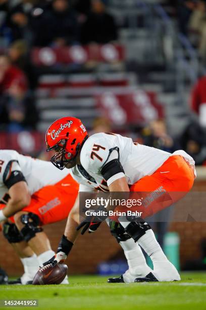 Center Preston Wilson of the Oklahoma State Cowboys prepares to snap the ball before Bedlam against the Oklahoma Sooners at Gaylord Family Oklahoma...
