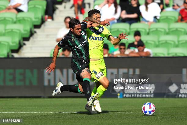 Joshua Risdon of United and Enrique Lopez, 'Kadete', of Victory compete for the ballduring the round nine A-League Men's match between Western United...