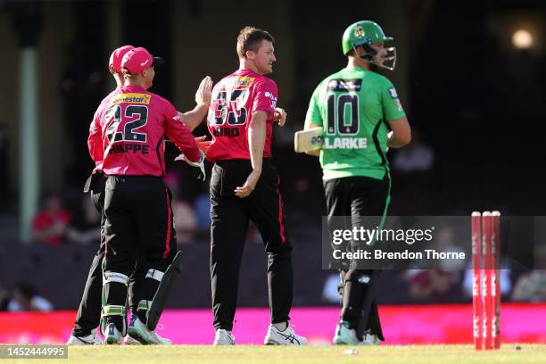 Jackson Bird of the Sixers celebrates with team mates after claiming the wicket of Joe Clarke of the Stars during the Men's Big Bash League match...