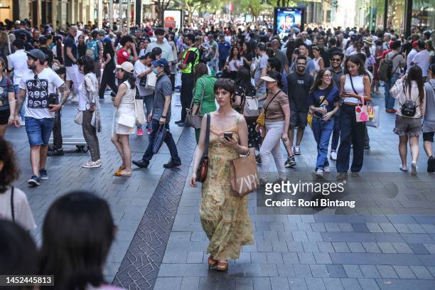 Shoppers flock to Pitt Street Mall during Boxing Day sales on December 26, 2022 in Sydney, Australia. Retailers offer massive discounts and enticing...