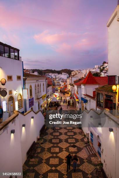 narrow market street - albufeira stock-fotos und bilder