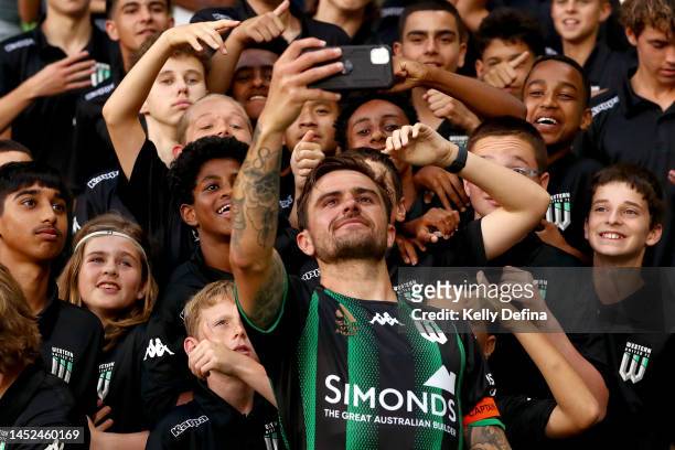 Joshua Risdon of United takes a selfie with supporters during the round nine A-League Men's match between Western United and Melbourne Victory at...
