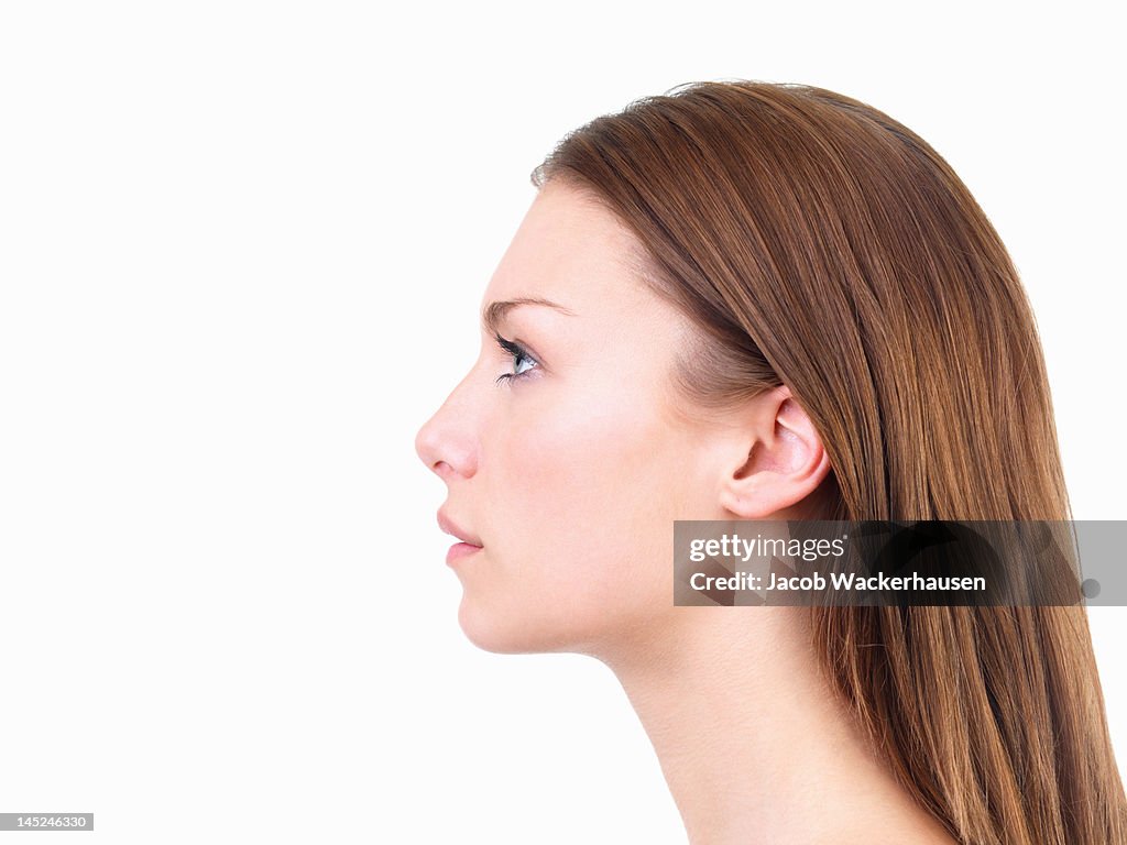 Beautiful young woman looking up