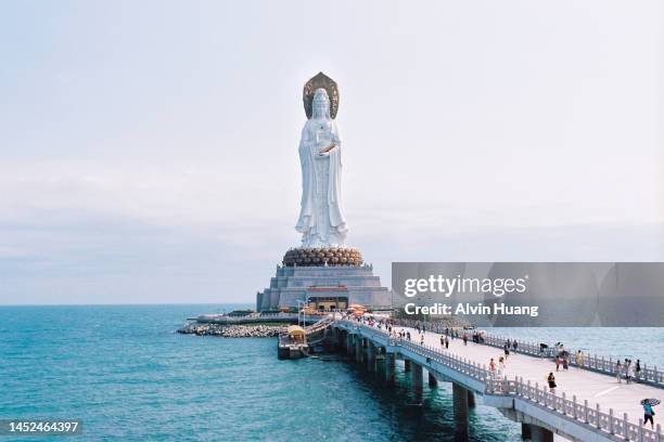 giant statue statue of the bodhisattva guanyin in hainan province, china - guanyin bodhisattva imagens e fotografias de stock