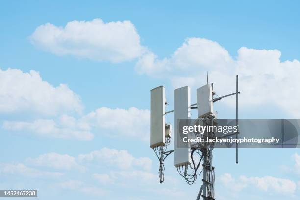 low angle view of communications tower against sky - telecom tower stock pictures, royalty-free photos & images