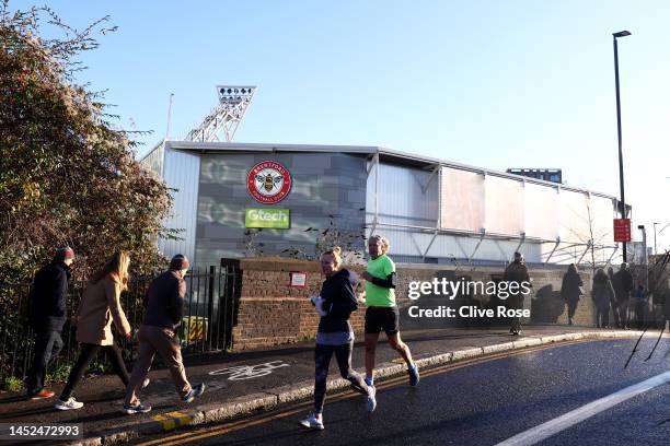 General view outside the stadium as runners are seen prior to the Premier League match between Brentford FC and Tottenham Hotspur at Brentford...