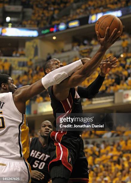 Dwyane Wade of the Miami Heat is fouled by Roy Hibbert of the Indiana Pacers in Game Six of the Eastern Conference Semifinals in the 2012 NBA...