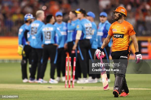 Faf du Plessis of the Scorchers walks from the field after being dismissed by Matthew Short of the Strikers during the Men's Big Bash League match...