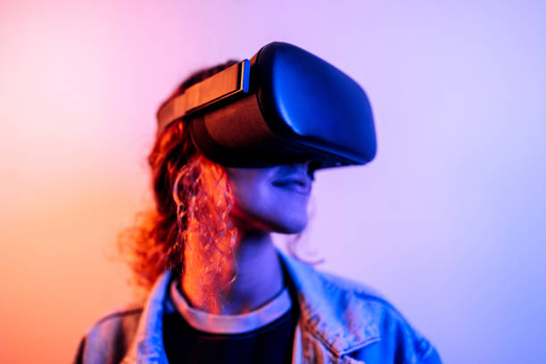Neon portrait of young woman wearing virtual reality headset