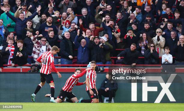 Vitaly Janelt of Brentford celebrates after scoring their side's first goal during the Premier League match between Brentford FC and Tottenham...