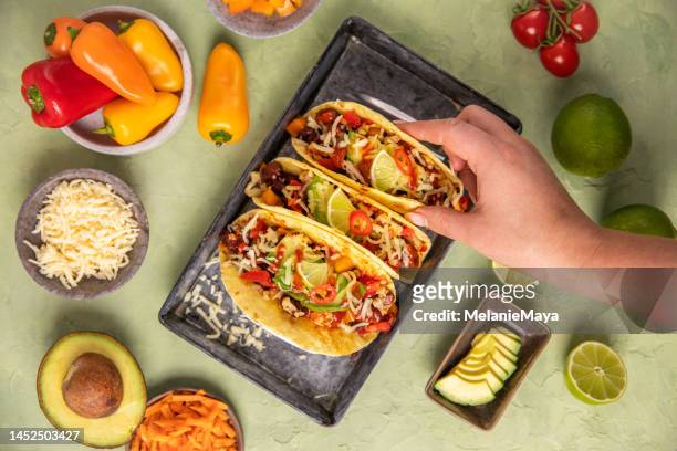 vegan tacos wraps tex mex food with beans, avocado, roast cauliflower and vegetables - taco stock pictures, royalty-free photos & images