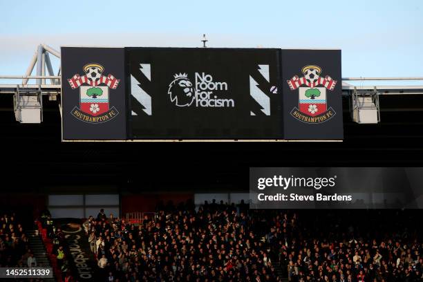 Players take a knee in support of the Black Lives Matter movement as an LED board reads 'No room for racism' prior to the Premier League match...