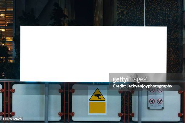 blank billboard on the building. useful for your advertisement in shopping mall/train station - bill posting stock pictures, royalty-free photos & images