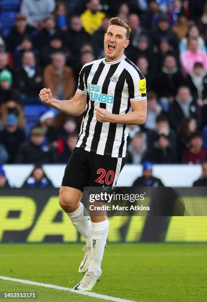 Chris Wood of Newcastle United celebrates after scoring the team's first goal from the penalty spot during the Premier League match between Leicester...