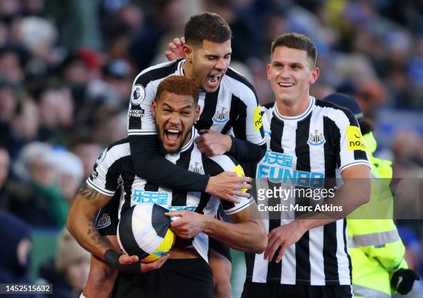 Joelinton of Newcastle United celebrates with teammates after scoring the team's third goal during the Premier League match between Leicester City...