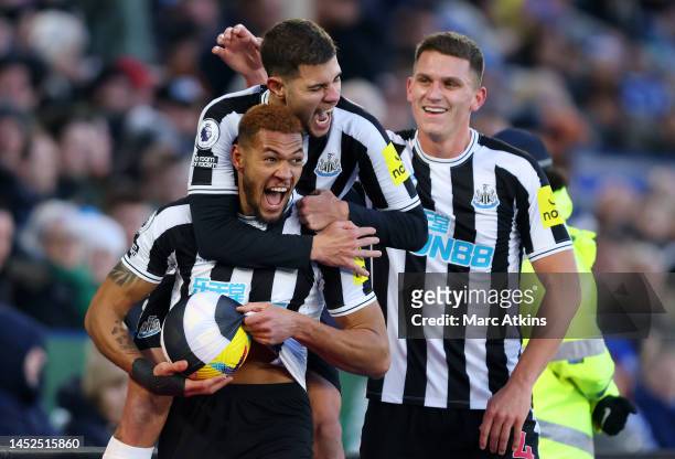 Joelinton of Newcastle United celebrates with teammates after scoring the team's third goal during the Premier League match between Leicester City...