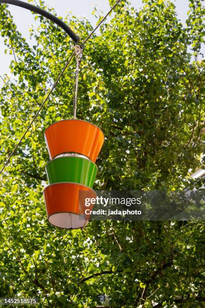 two orange and a green lampshade - green party bildbanksfoton och bilder