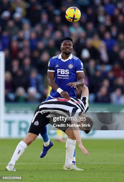 Daniel Amartey of Leicester City battles for possession with Chris Wood of Newcastle United during the Premier League match between Leicester City...