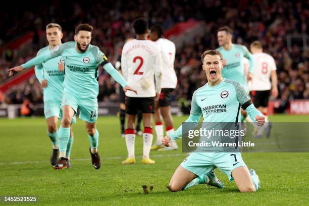 Solly March of Brighton & Hove Albion celebrates after scoring their sides third goal during the Premier League match between Southampton FC and...