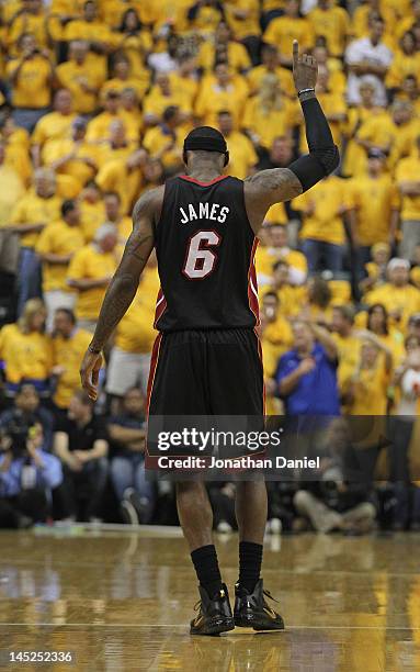 LeBron James of the Miami Heat holds up his hand before the Heat take on the Indiana Pacers in Game Six of the Eastern Conference Semifinals in the...