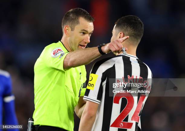 Miguel Almiron of Newcastle United argues with referee Jarred Gillett during the Premier League match between Leicester City and Newcastle United at...