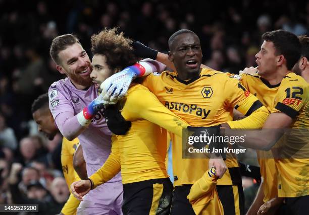 Rayan Ait-Nouri of Wolverhampton Wanderers celebrates with Jose Sa and teammates after scoring the team's second goal during the Premier League match...