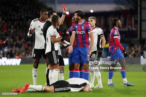 James Tomkins of Crystal Palace is shown a red card by match referee Andrew Madley during the Premier League match between Crystal Palace and Fulham...