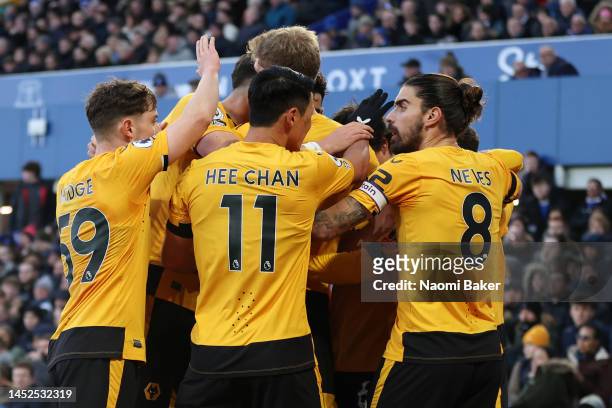 Daniel Podence of Wolverhampton Wanderers celebrates with teammates after scoring the team's first goal during the Premier League match between...