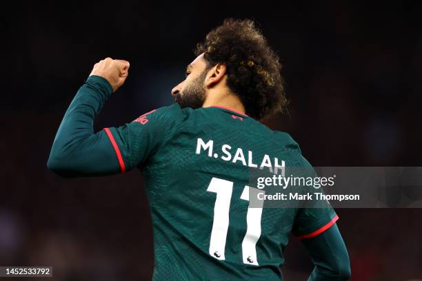 Mohamed Salah of Liverpool celebrates after scoring their side's first goal during the Premier League match between Aston Villa and Liverpool FC at...