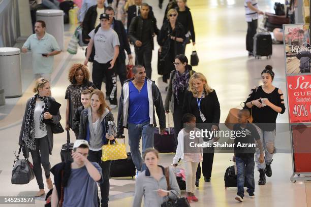 Rocco Ritchie, Brahim Zaibat, Madonna, Mercy James, David Banda Mwale and Lourdes Leon at JFK Airport on May 24, 2012 in New York City.