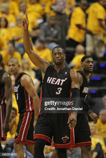 Dwyane Wade of the Miami Heat holds up his finger after hitting a shot and being fouled against the Indiana Pacers in Game Six of the Eastern...