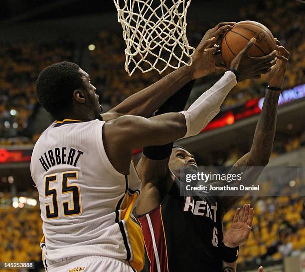 LeBron James of the Miami Heat takes a rebound away from Roy Hibbert of the Indiana Pacers in Game Six of the Eastern Conference Semifinals in the...