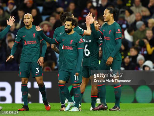 Virgil van Dijk of Liverpool celebrates with teammate Darwin Nunez after scoring their side's second goal during the Premier League match between...