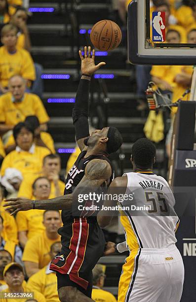 LeBron James of the Miami Heat puts up a shot over Roy Hibbert of the Indiana Pacers watch in Game Six of the Eastern Conference Semifinals in the...