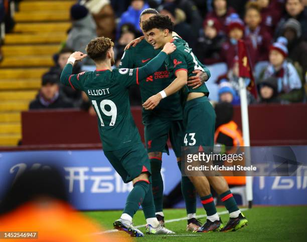 Stefan Bajcetic of Liverpool celebrates with teammates Harvey Elliott and Darwin Nunez after scoring their side's third goal during the Premier...
